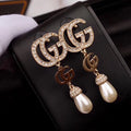 G u c c I earrings
